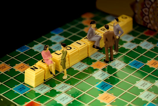 3 men in gray suit standing beside yellow lego blocks