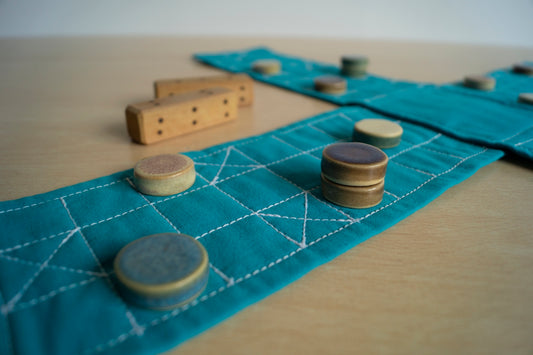 a close up of a table with buttons and a piece of cloth