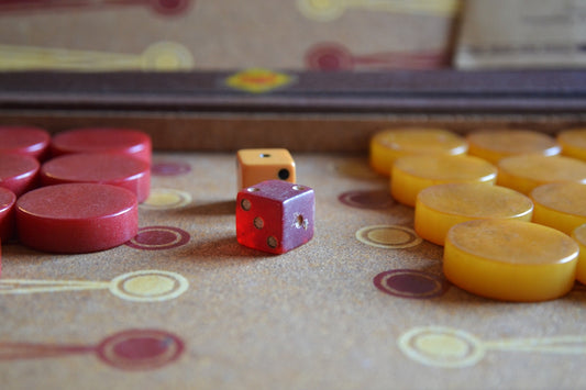 Two dice and game pieces on a board